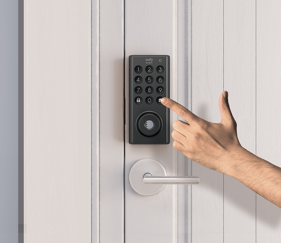 Person entering code into door lock