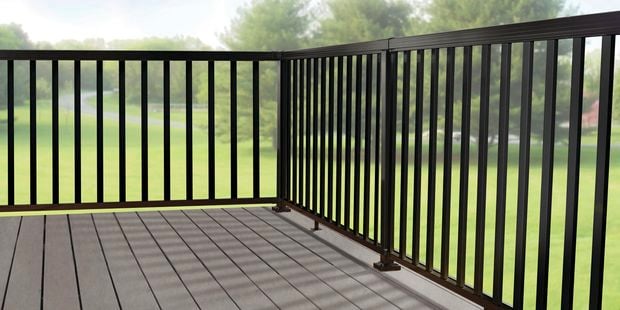Black fence on wooden deck. 