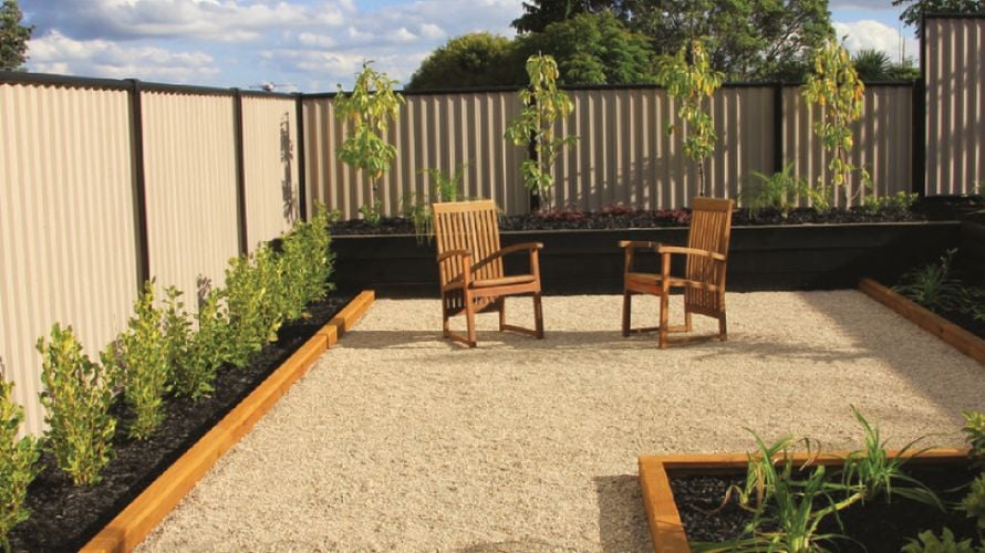 Gravel outside area with tables and chairs