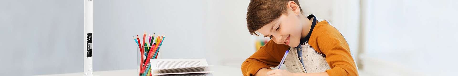 Child using pen at desk