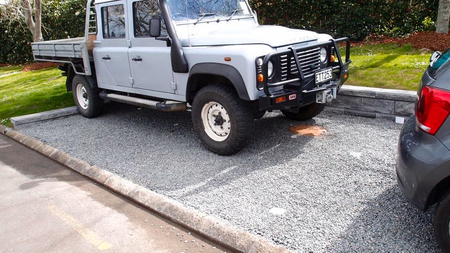 Gravel parking with vehicle grade paving installed