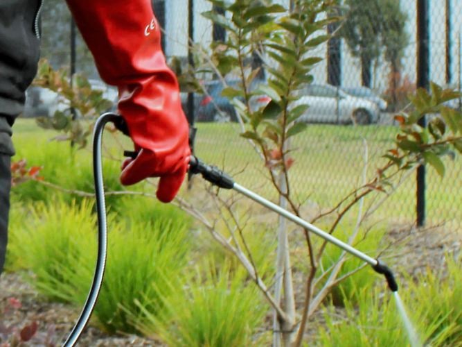 Spray attachment being used in a field