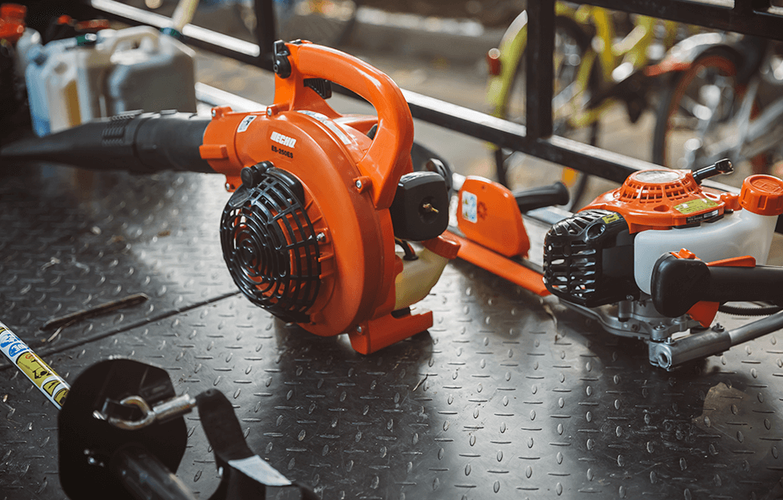 Array of Echo powered tools including hedge trimmer and leaf blower