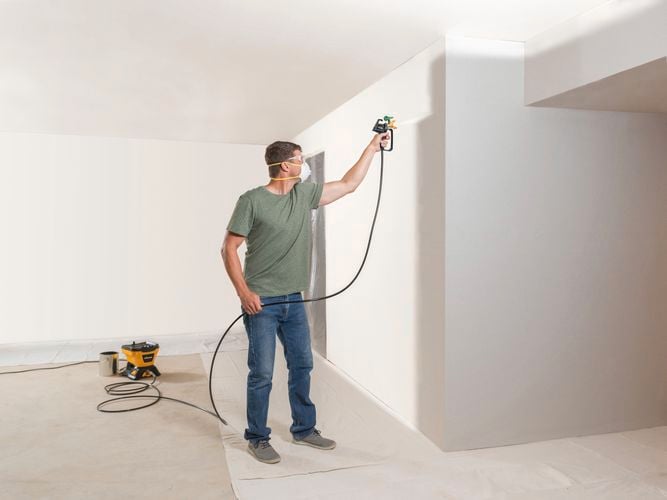 Wagner
  Control Pro 150M with T2 gun to spray interior of home with off-white paint