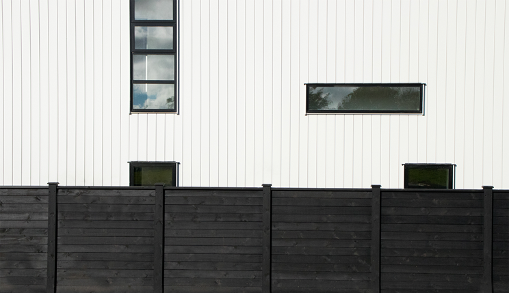 Black painted laminated timber fencing