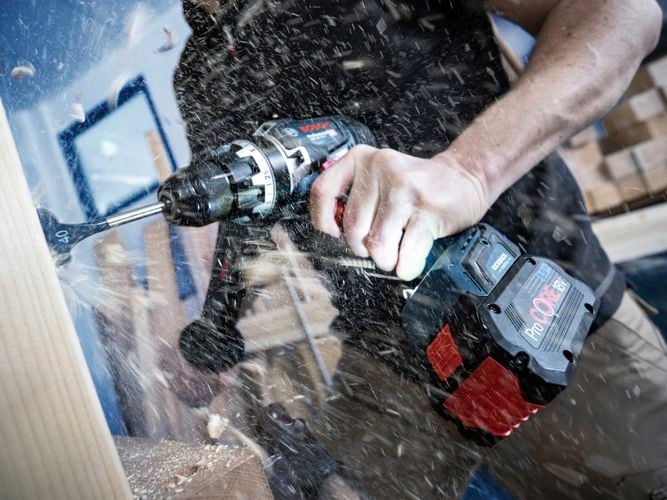 Person drilling with the world's strongest* 18V drill.