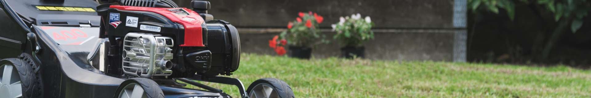 Lawn mower mowing lawn.
