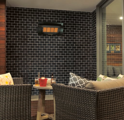 Outdoor lounge area with chairs and outdoor heater