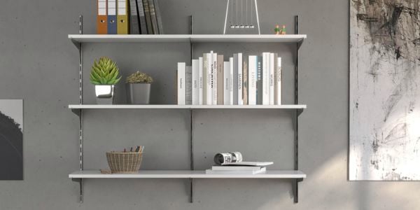 Shelf on grey wall.
