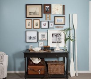 Pictures hung on a blue wall