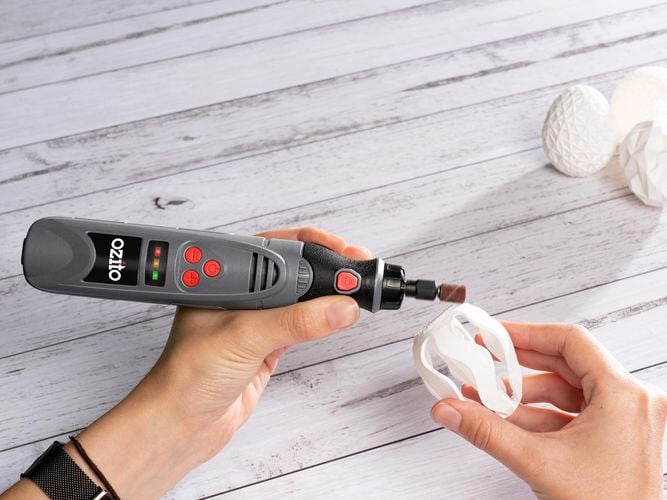Ozito rotary tool is used to detail a fine egg ornament