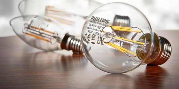 assorted light globes displayed on timber top