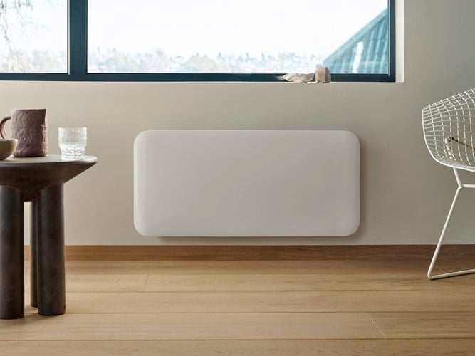 Smart WiFi panel heater mounted on a wall.