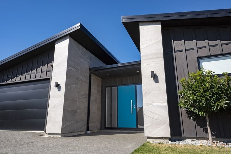 Entry to modern home with blue front door