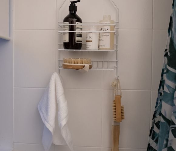 Shower caddy with soaps and towel