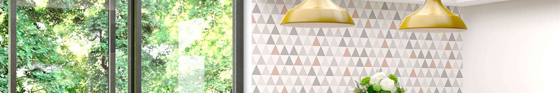 A room with Graham & Brown wallpaper, a window and pendant lights.