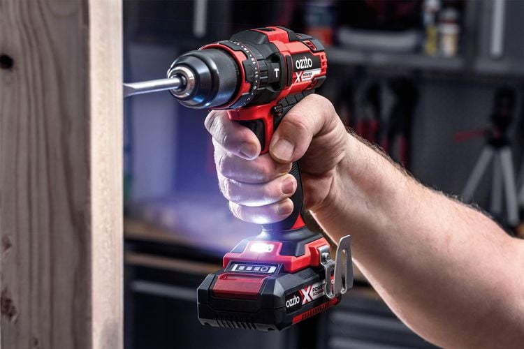 Person drilling into timber