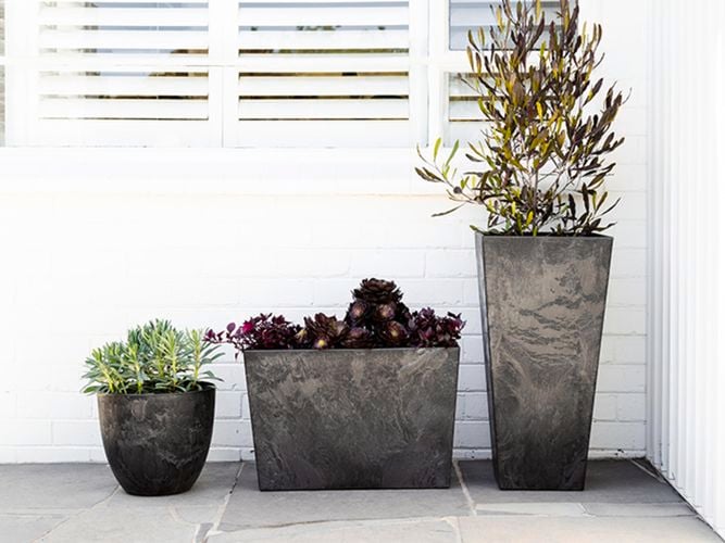 Tuscan Path's Stone Art Outdoor Pot range in black.