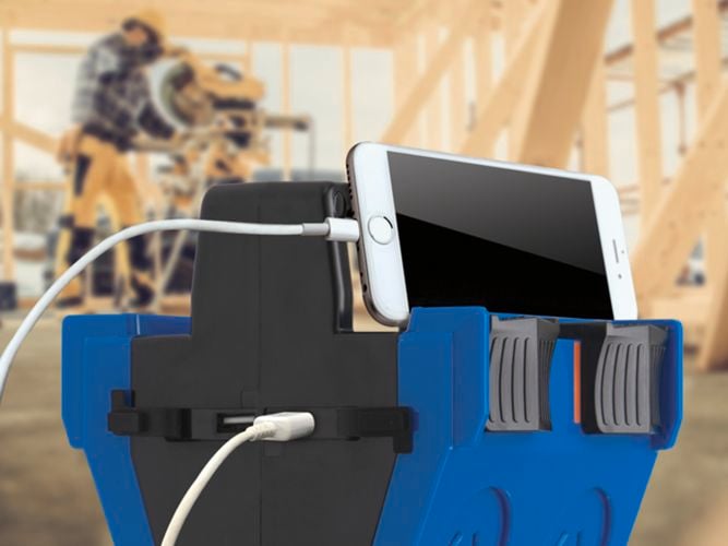 Mobile phone plugged into a 4-outlet heavy duty power block.