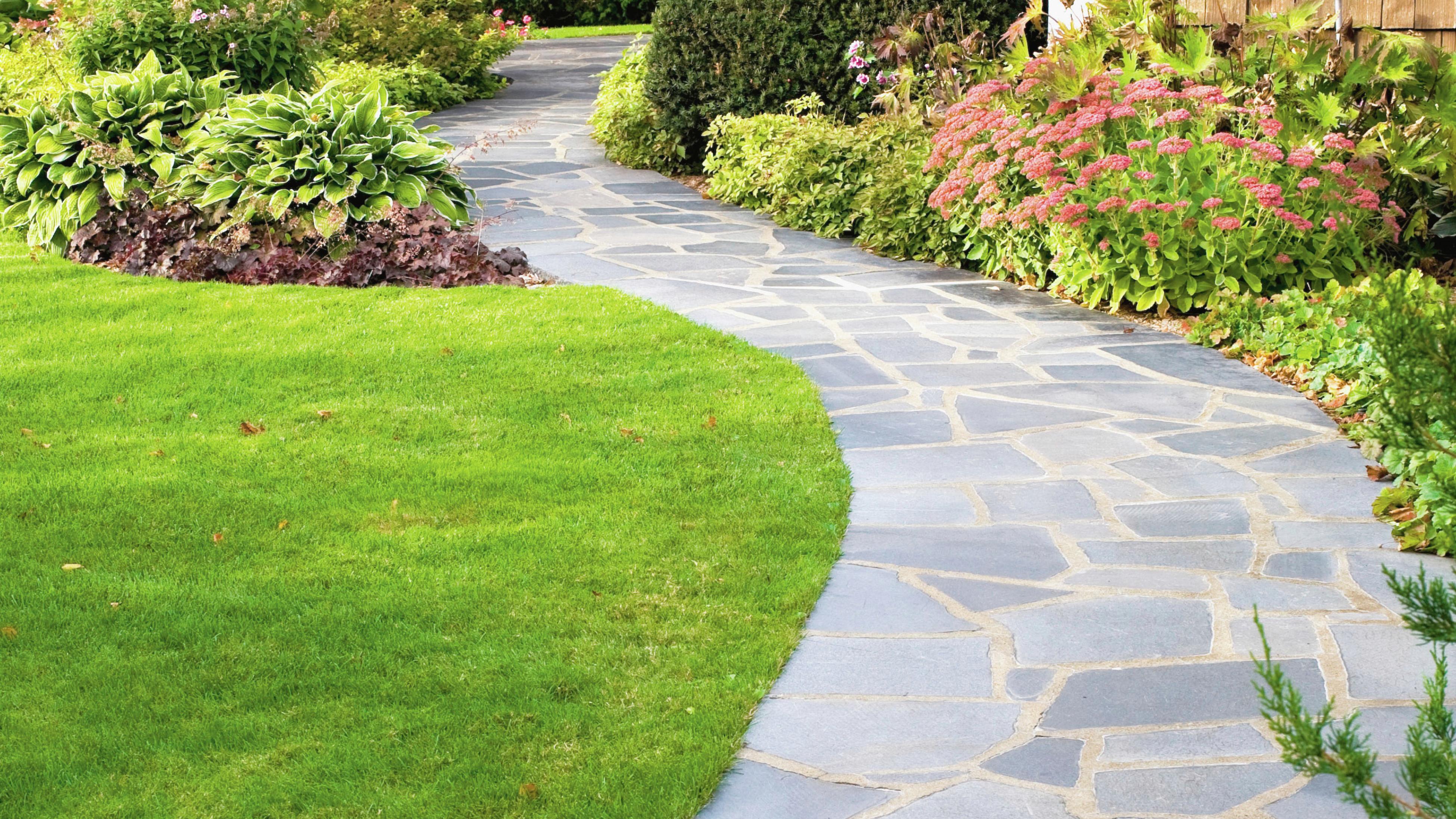 A paved walkway to a home
