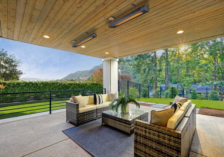 Covered outdoor entertaining area with heaters attached to ceiling