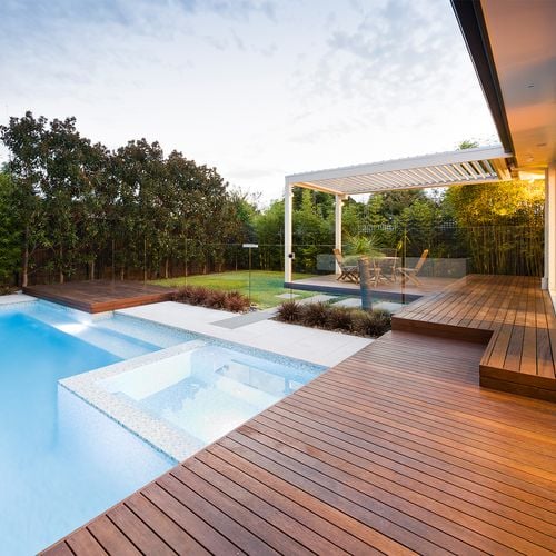 Backyard with timber decking and a pool