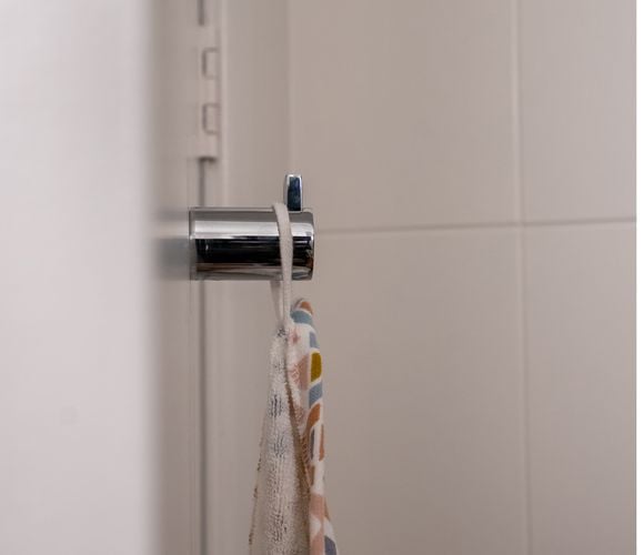 Steel hand towel hook in bathroom