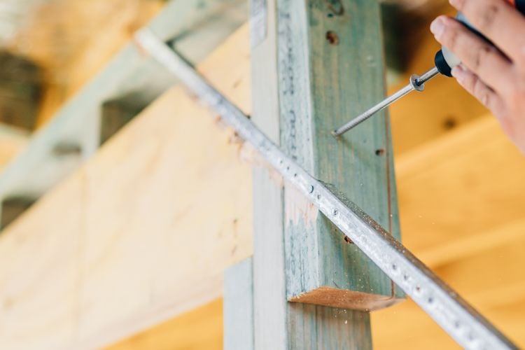 Screw being drilled into timber