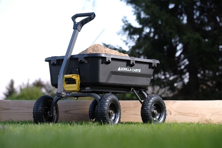 Cart full of sand in backyard