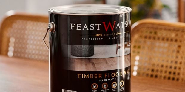 Timber floor wax tin on table.
