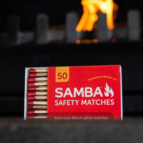 Box of matches in front of a fireplace