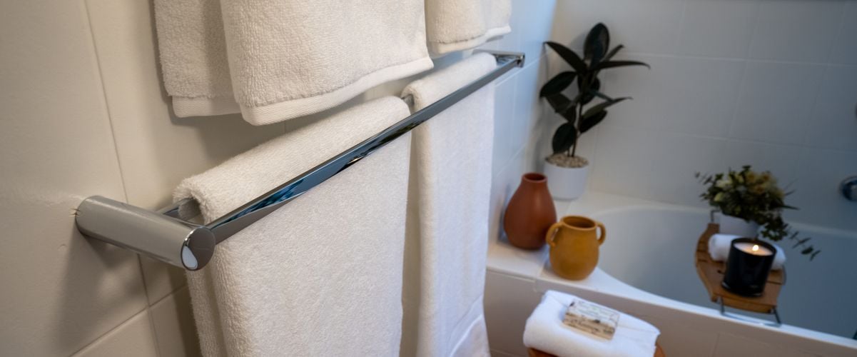 Bath towels hung in bathroom
