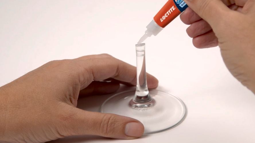 Wine glass being repaired with Loctite Glass Glue.