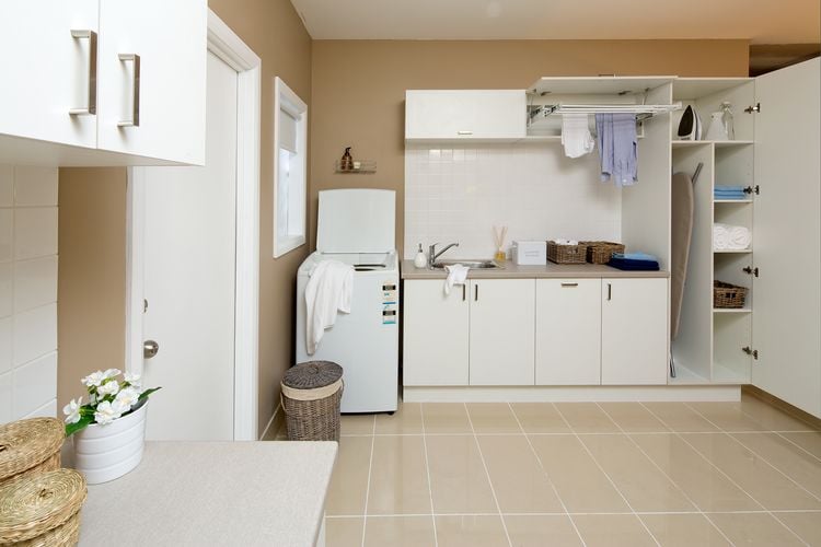 Laundry with cabinets and washing machine