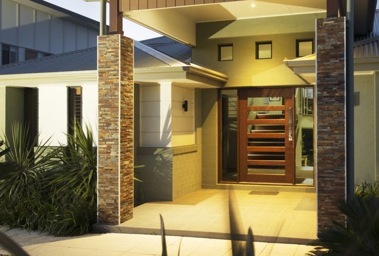 Front entryway to home with columns and large front door