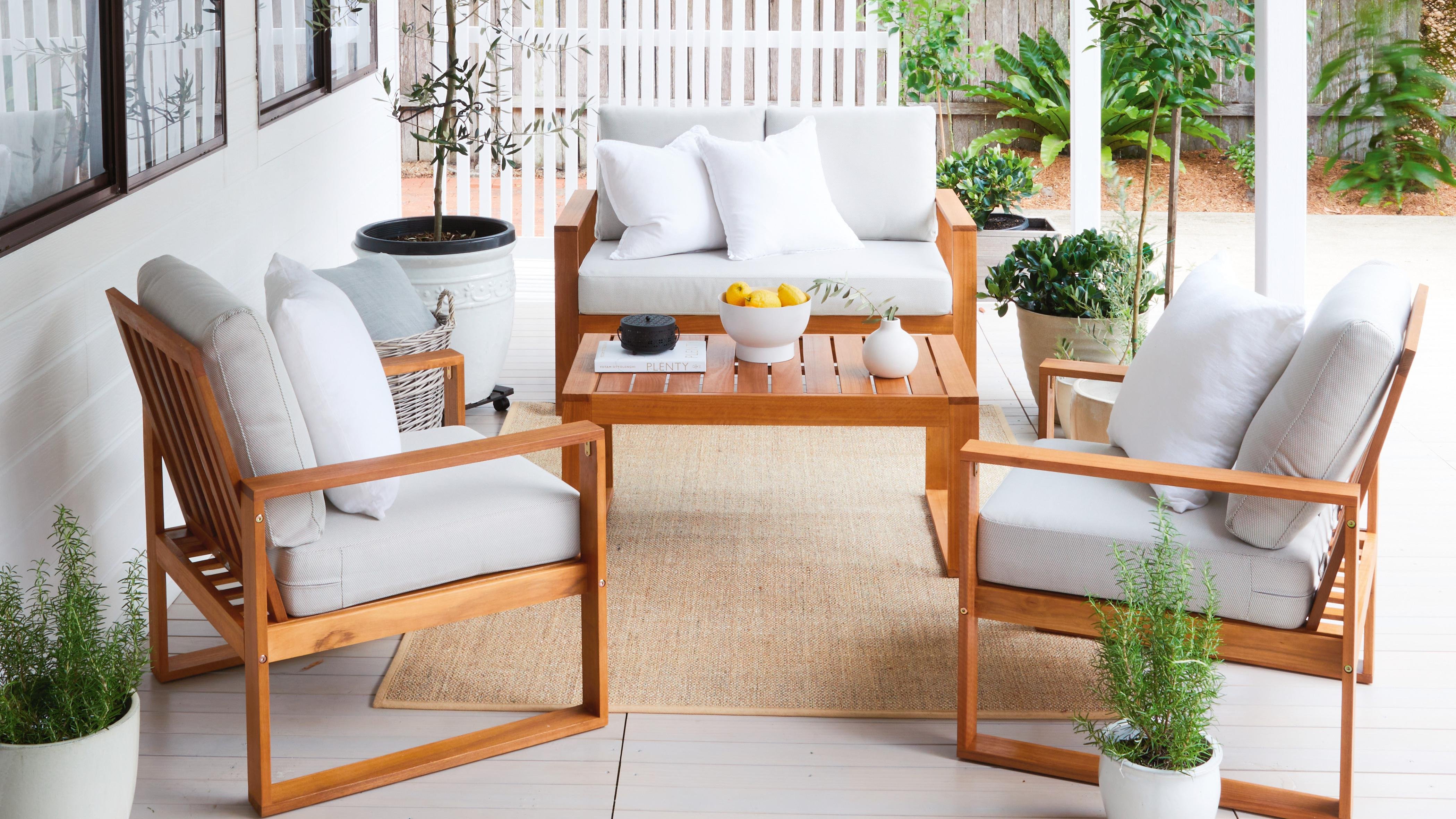 Deck with timber outdoor furniture and potted plants