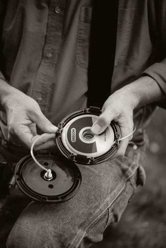 Person replacing wiring in grass clipper