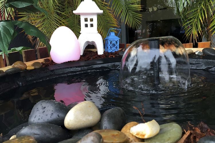 Small fountain in a backyard water feature