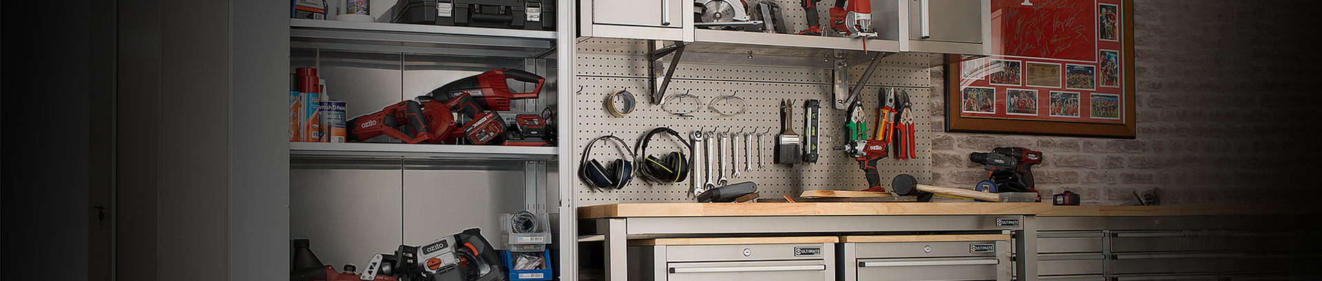 Garage with workbench and pegboard storing tools.
