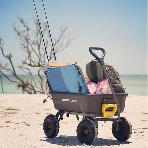 Cart full of beach gear including chair and fishing poles