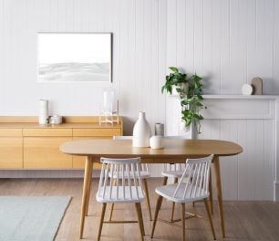 Timber dining table with white chairs
