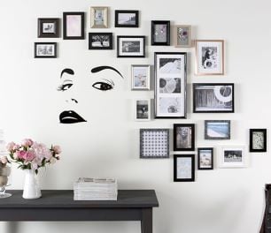 Framed pictures hung on wall