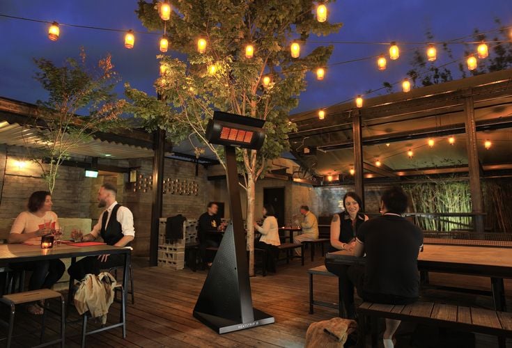 Outdoor restaurant dining area with outdoor heater