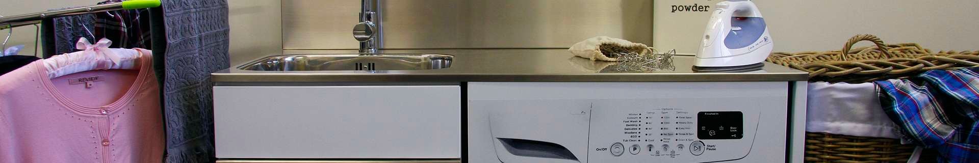 Laundry with washing machine, clothesline and iron.