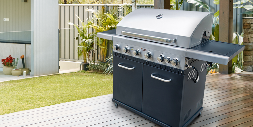 Moderate-sized barbecue on a timber deck