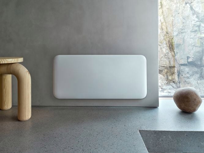 Smart WiFi panel heater mounted on a wall.