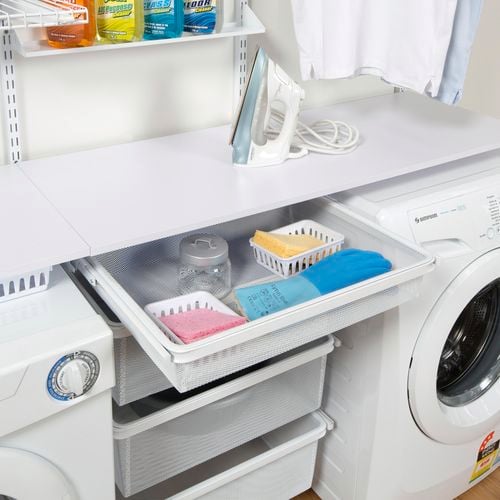 Drawer shelf in laundry.