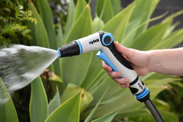 Close up of hand on nylex trigger spray gun 