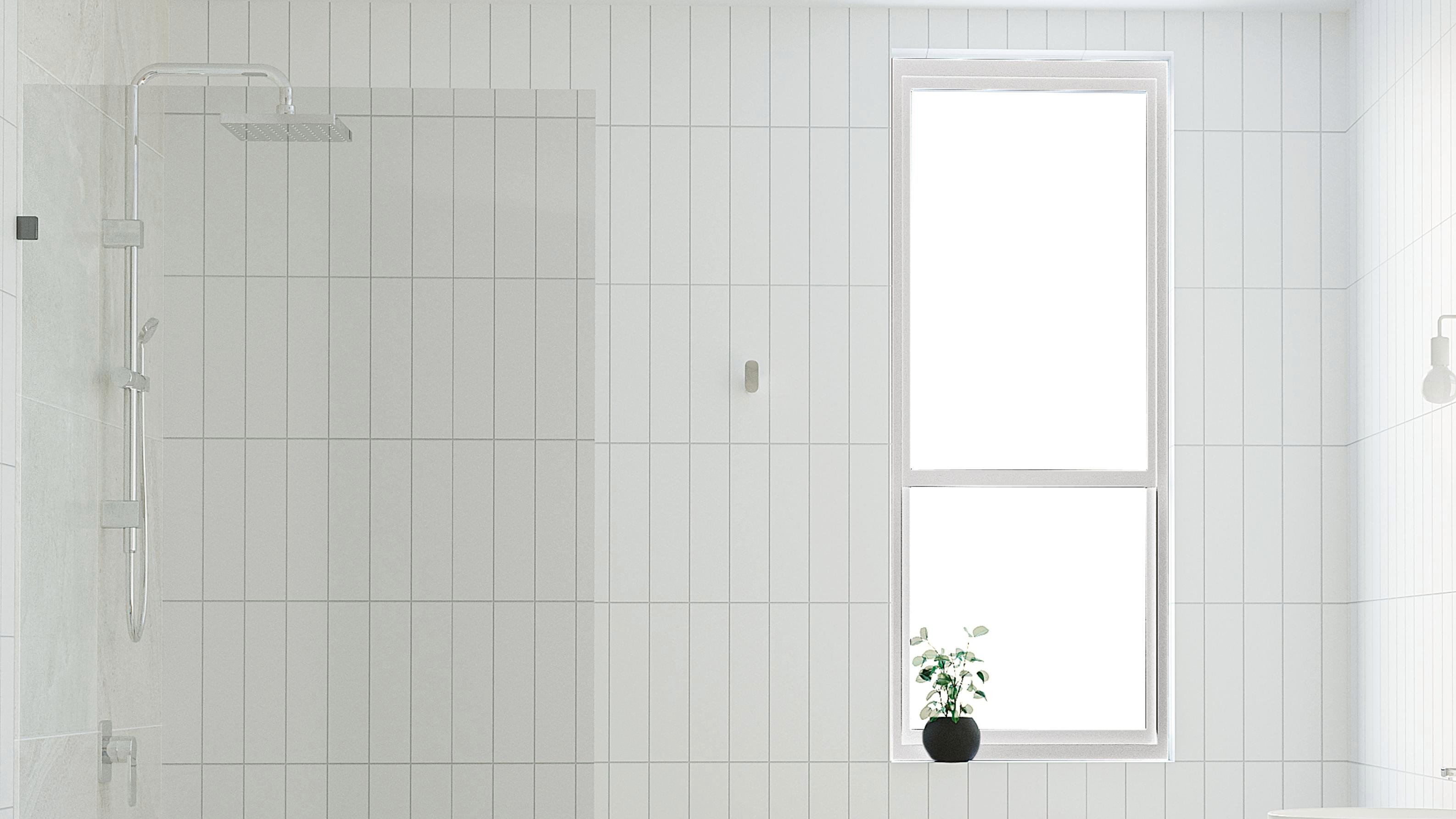 modern bathroom with white tiles, freestanding bath, timber vanity and double mirrors