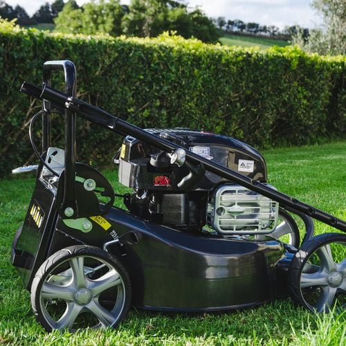 Push lawn mower in backyard